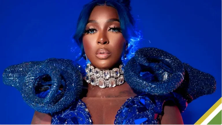 Dancehall artist in an elaborate blue crystal-embellished editorial look